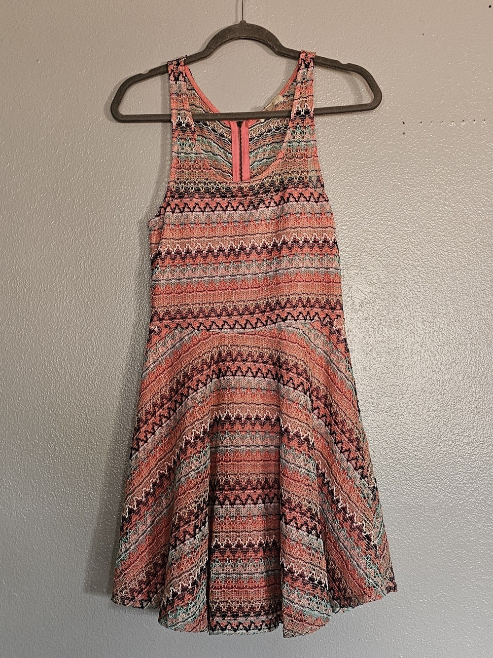 Love Fire sleeveless dress features a pink patterned crochet lace design